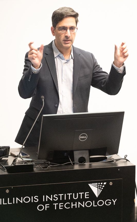 Guest speaker Lio Patcher at the lecturn