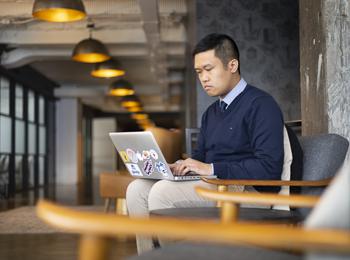 A social sciences student works at an internship downtown