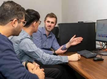 Illinois Tech Dawson Lab image in front of computer at desk