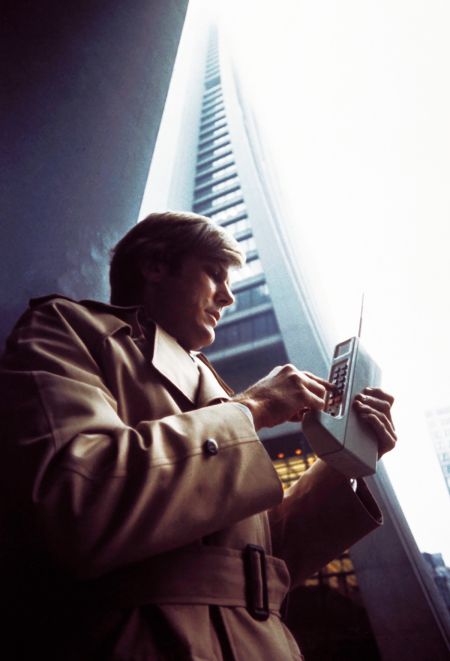 This image appeared in Motorola’s 1973 annual report with the caption, "A product truly ahead of its time, the DYNA-T.A.C. portable radiotelephone system, first demonstrated by Motorola in 1973, is similar to a normal dial telephone, but can be carried with the subscriber and used anywhere within the area of coverage."