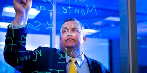 Illinois Tech Professor of Applied Mathematics Fred Hickernell works on equations
